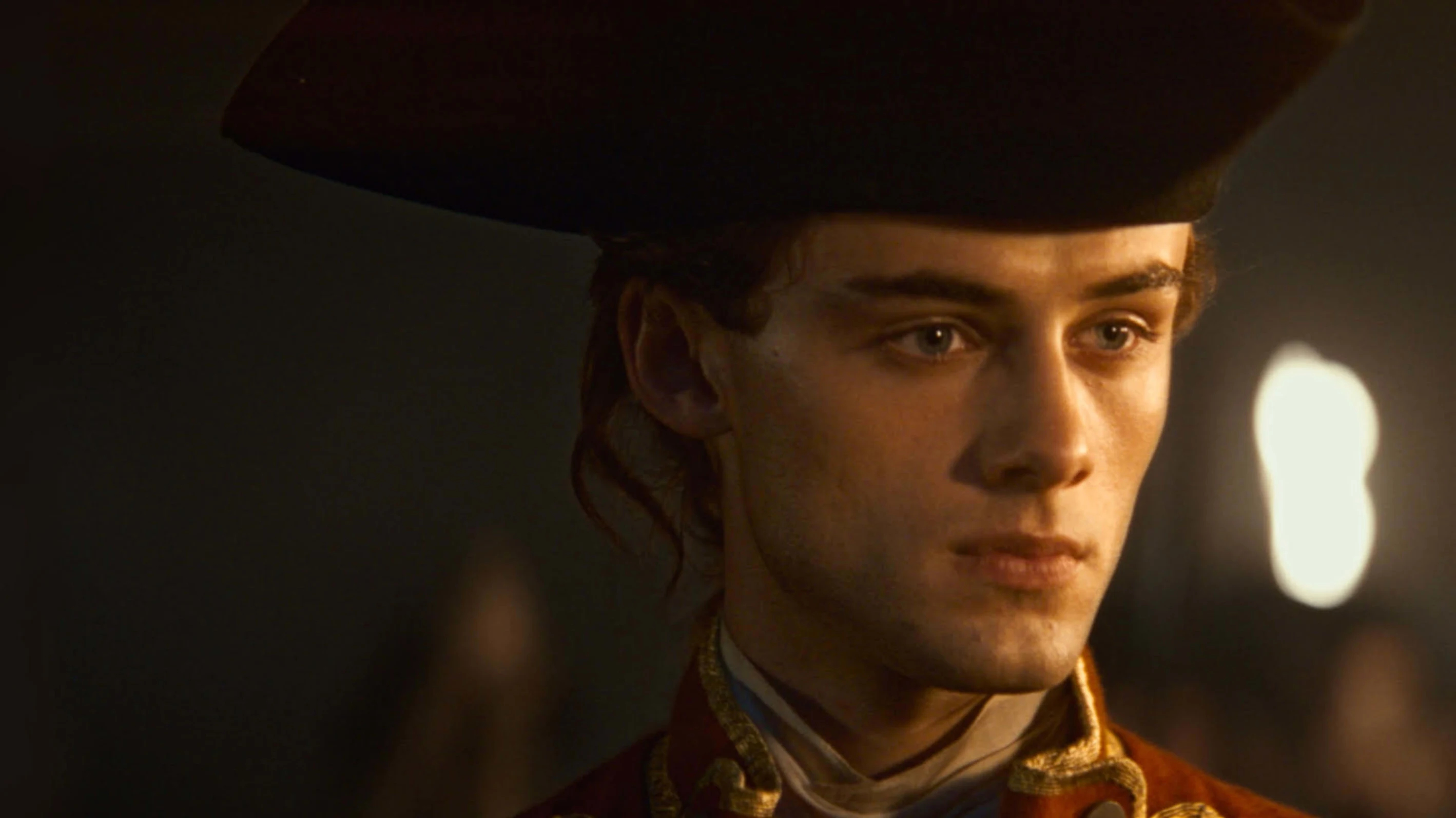 William Franklyn-Miller as a young George Washington, lit by firelight.